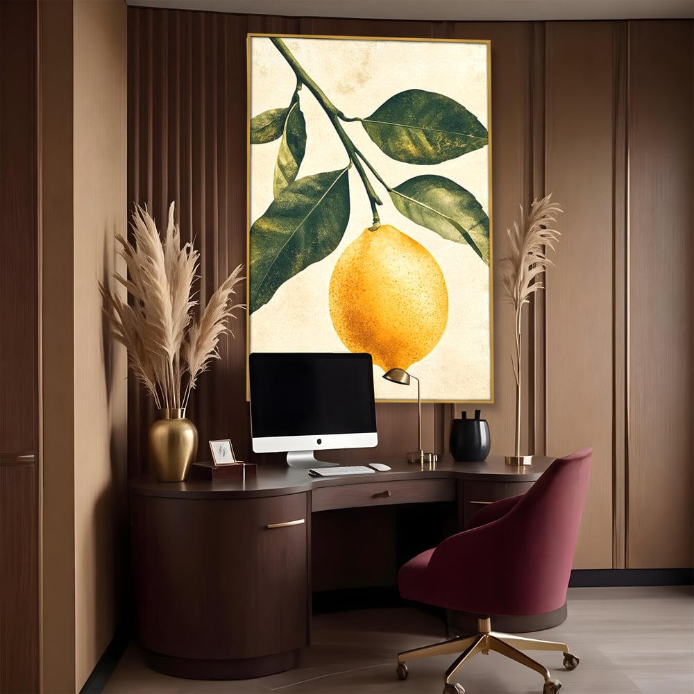 Tablou canvas cu ilustratie botanica cu lamaie si frunze, in rama de aluminiu auriu, pe perete intr-un birou